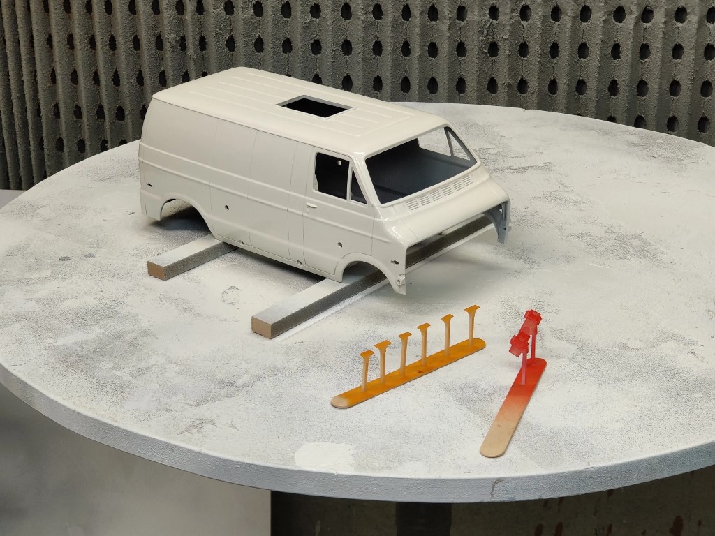Spray painting the bodyshell of a Tamiya Lunchbox RC van.
